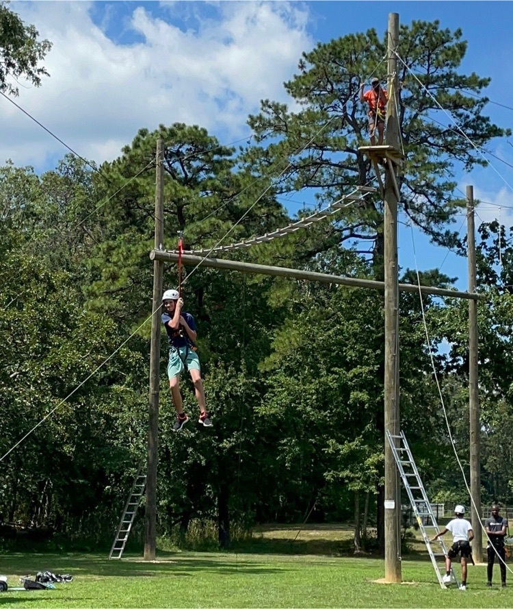 Team building on the ropes course. 