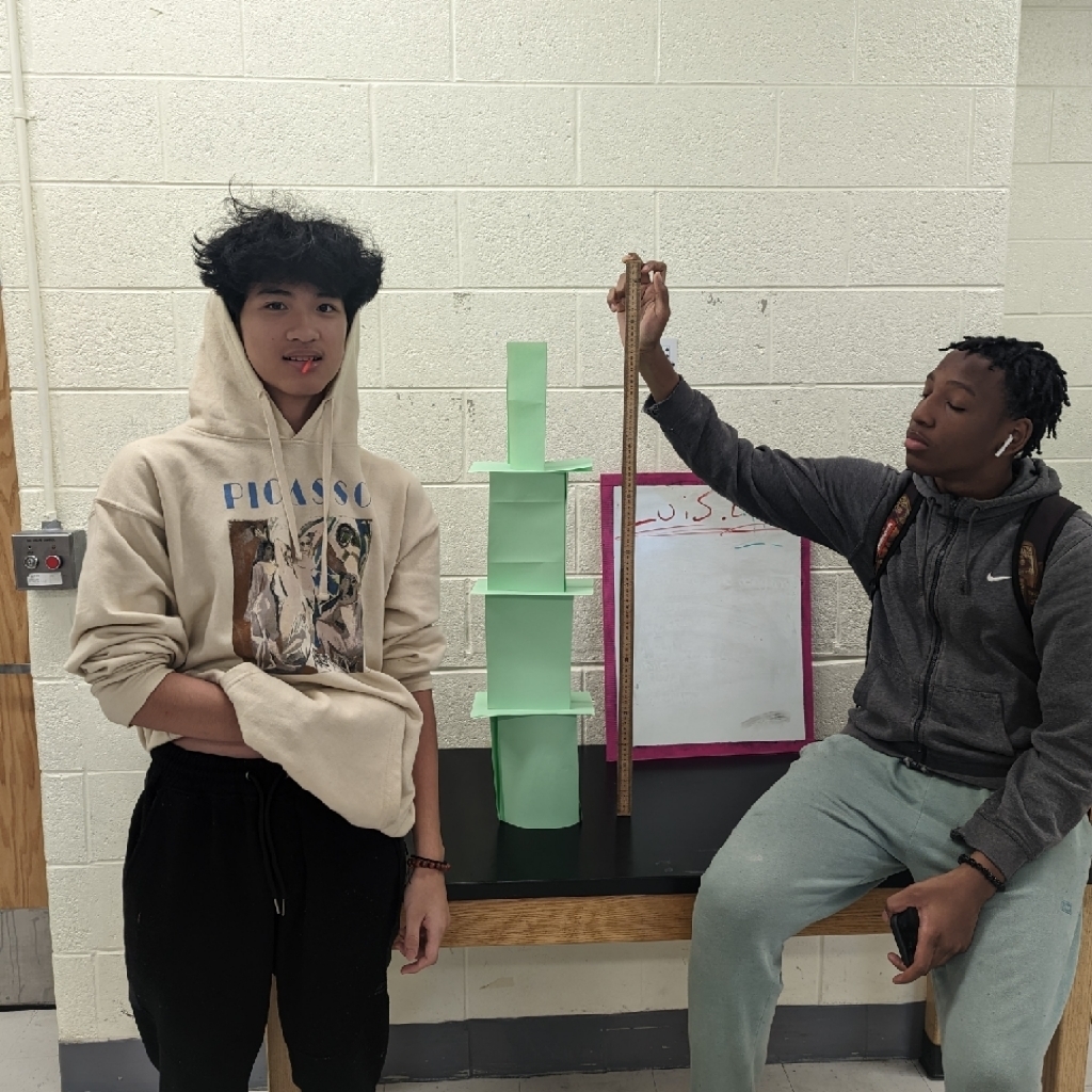 two students with their paper tower
