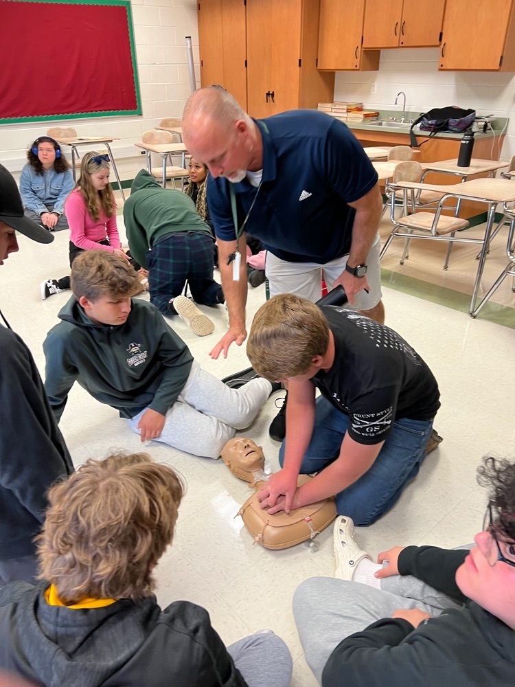 Junior health class learning CPR with Mr. Gehres 