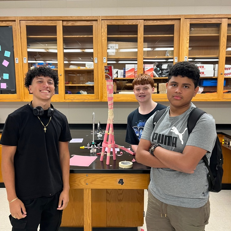 students pose with tallest tower 